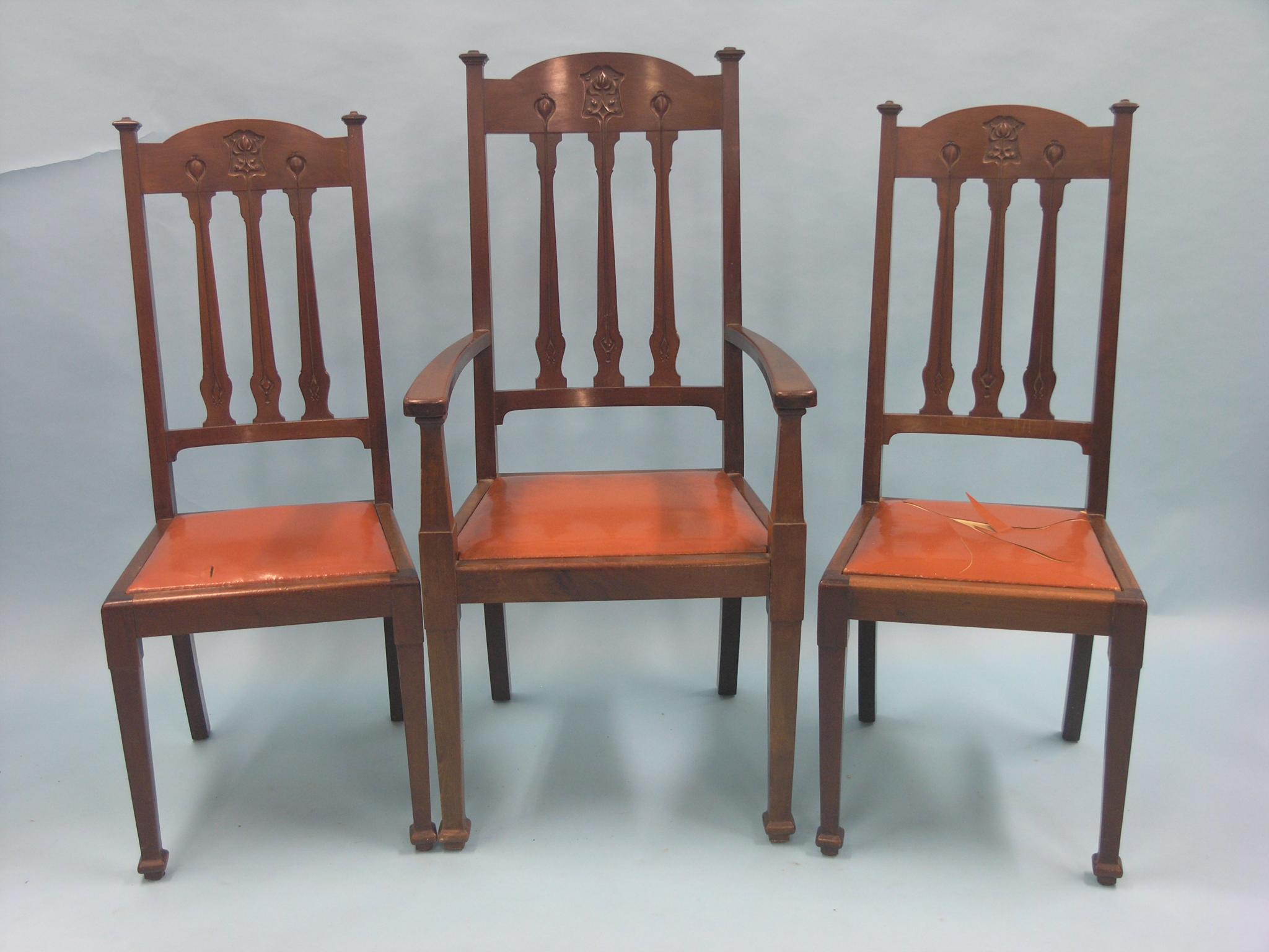 Appraisal: A set of three Edwardian mahogany dining chairs including carver