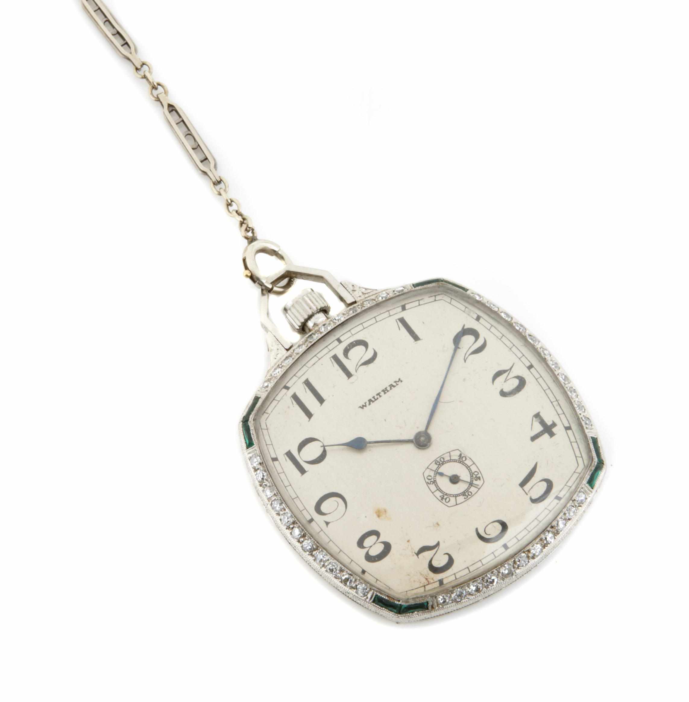 Appraisal: A diamond green stone platinum and white gold pocket watch