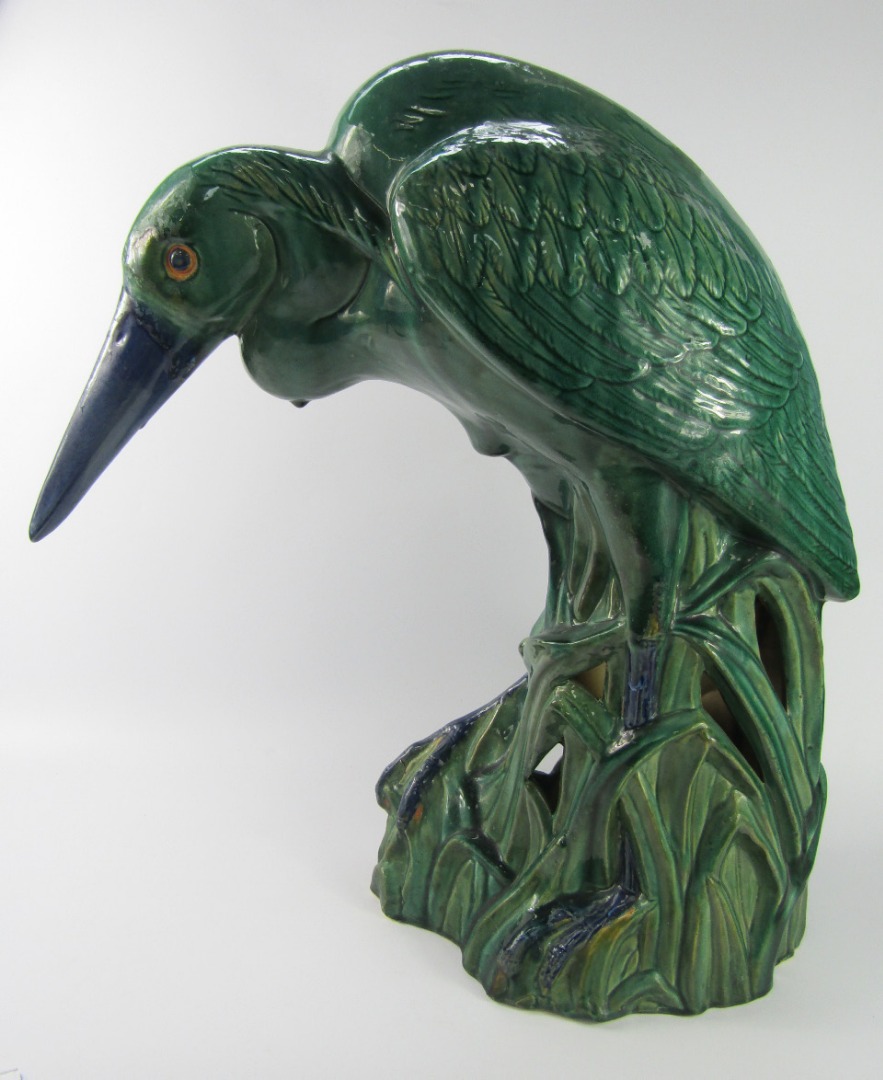 Appraisal: A green and blue glazed pottery figure of a heron