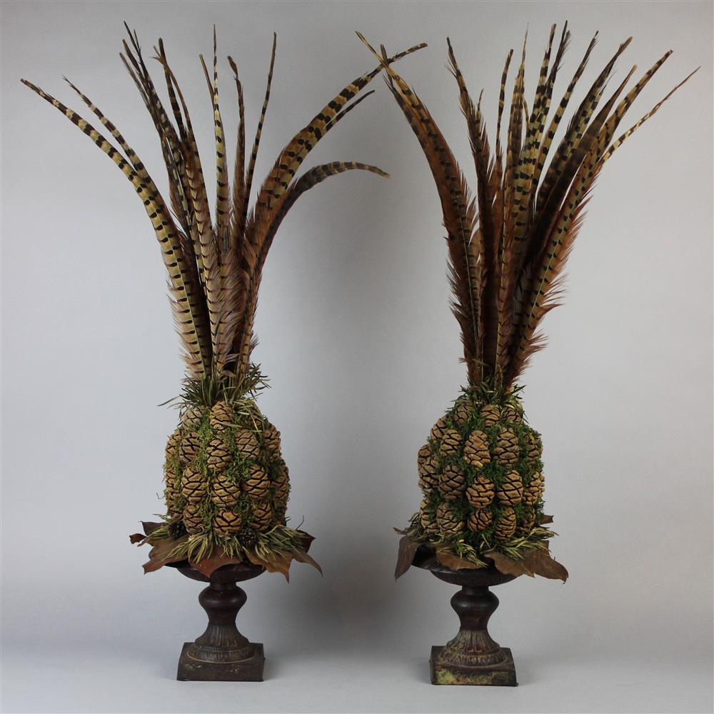 Appraisal: PAIR OF DECORATIVE TABLE ORNAMENTS with cast iron urn-form bases