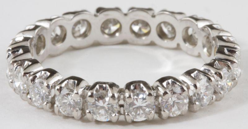 Appraisal: Platinum Diamond Eternity Band with a flat shank and prong