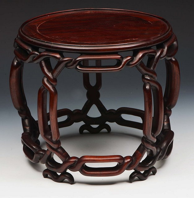 Appraisal: A CHINESE HARDWOOD 'barrel' shaped vase stand with rope twist