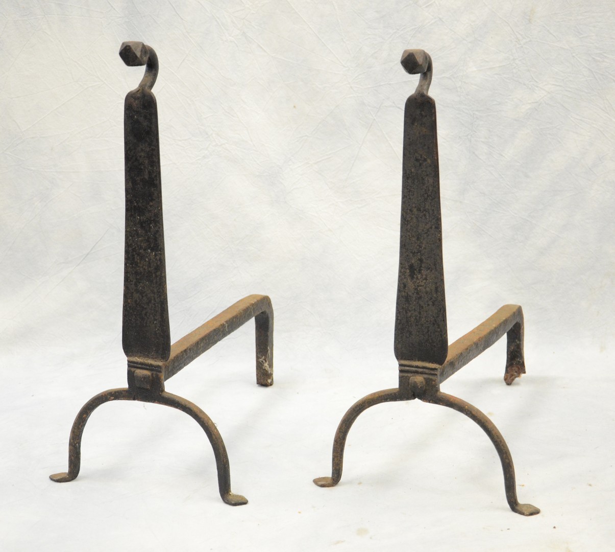 Appraisal: Pair of wrought iron knife blade andirons multi-sided finials early