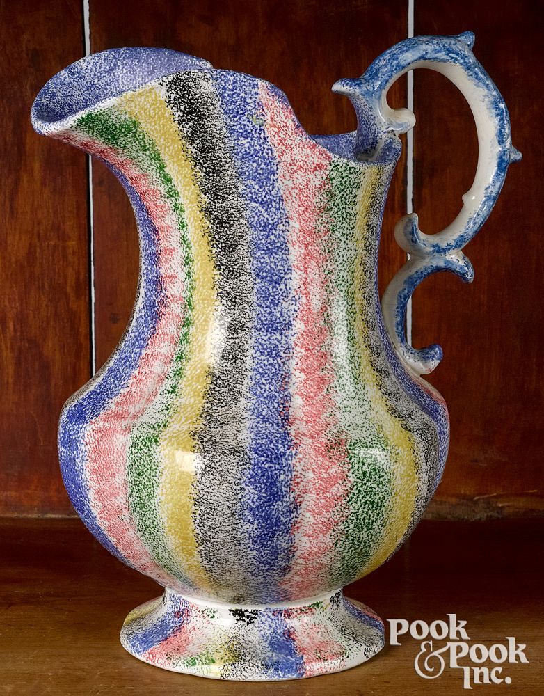 Appraisal: Five color rainbow spatter pitcher Five color rainbow spatter pitcher