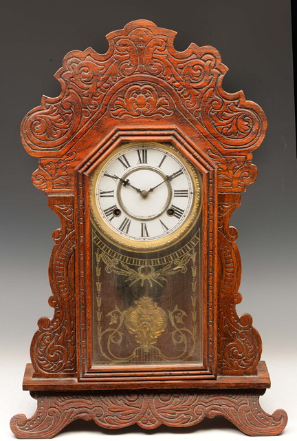 Appraisal: A LATE TH CENTURY AMERICAN GINGERBREAD SHELF CLOCK having a