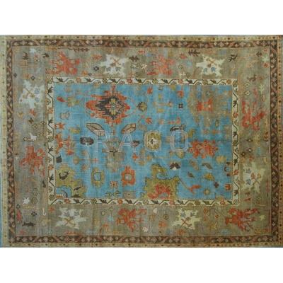 Appraisal: OUSHAK STYLE Contemporary room-size hand-knotted wool rug geometric floral design