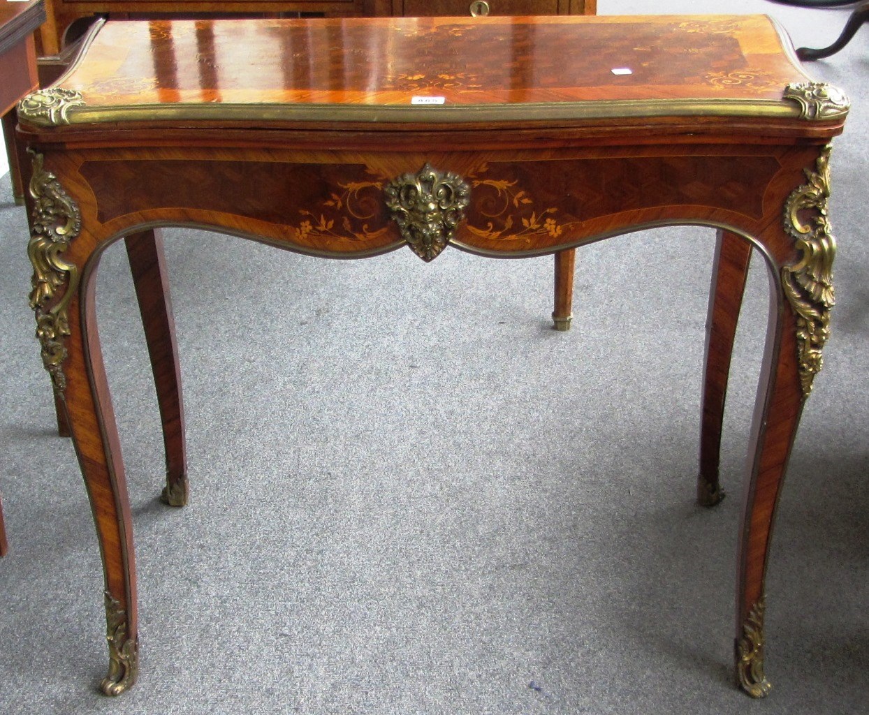 Appraisal: A th century marquetry inlaid gilt metal mounted kingwood and