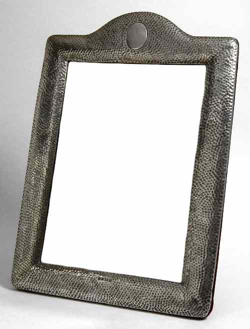 Appraisal: An Edward VII hammered silver rectangular dressing table mirror with