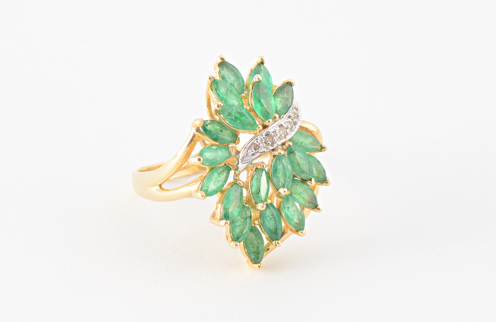 Appraisal: CASCADING EMERALD RING K yellow gold ring with marquise mixed