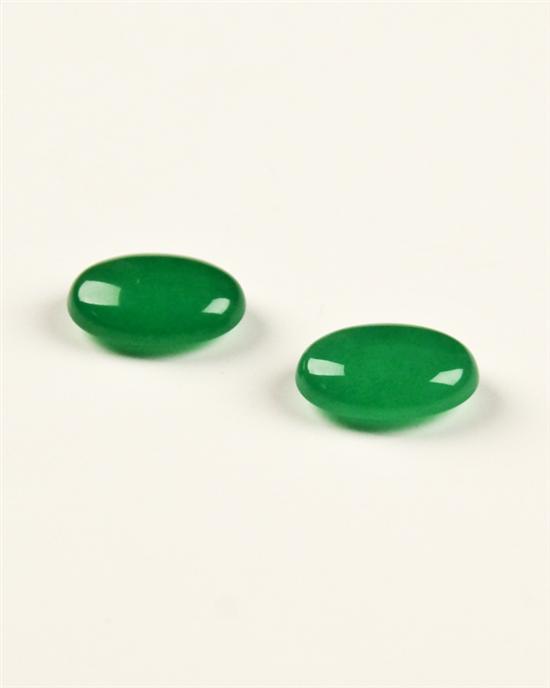 Appraisal: A Pair of Oval Jadeite Cabochons unset approximately cts total