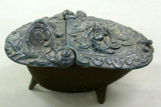 Appraisal: Victorian cast iron coalscuttle with teal blue glaze x