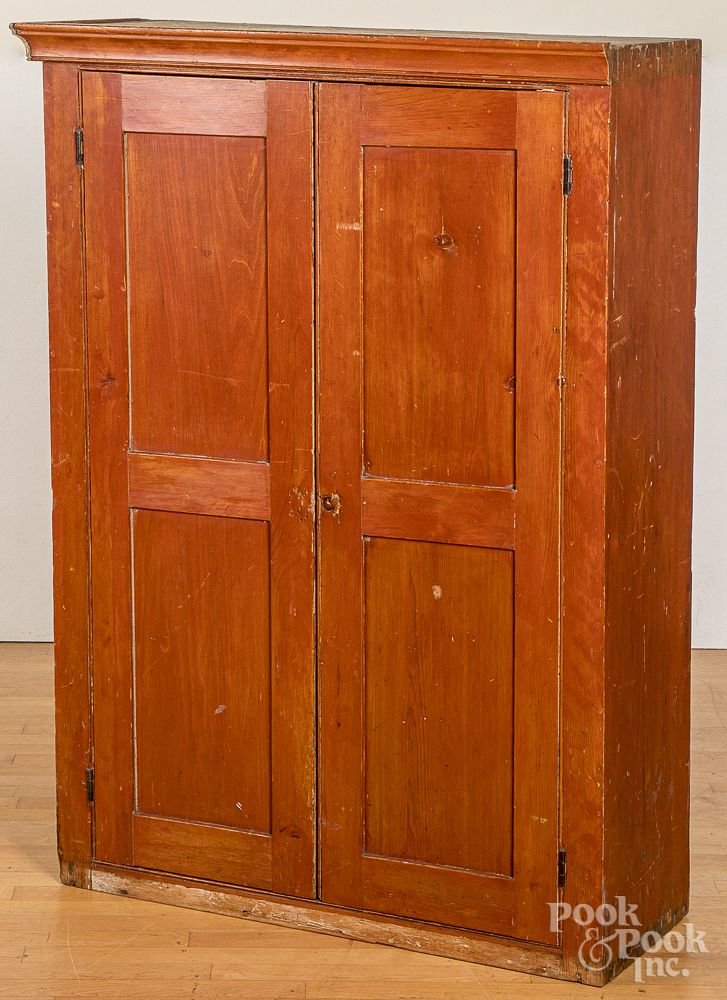 Appraisal: Stained pine cupboard Stained pine cupboard early th c retaining