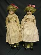 Appraisal: PAIR A M BISQUE TWINS Twins each bisque shoulder plate