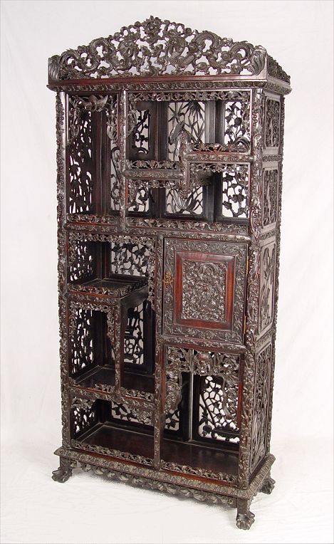 Appraisal: CHINESE MEIJI PERIOD CARVED ROSEWOOD ETAGERE Elaborate and fine carvings