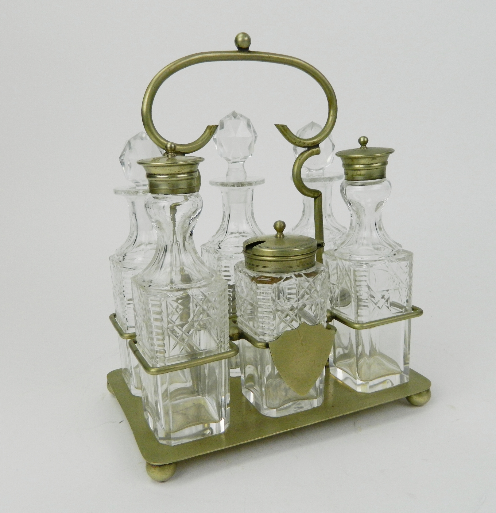 Appraisal: English cruet set c s EPNS six matching crystal bottles