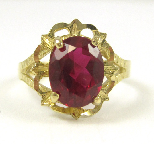 Appraisal: SYNTHETIC RUBY AND FOURTEEN KARAT GOLD RING set with a