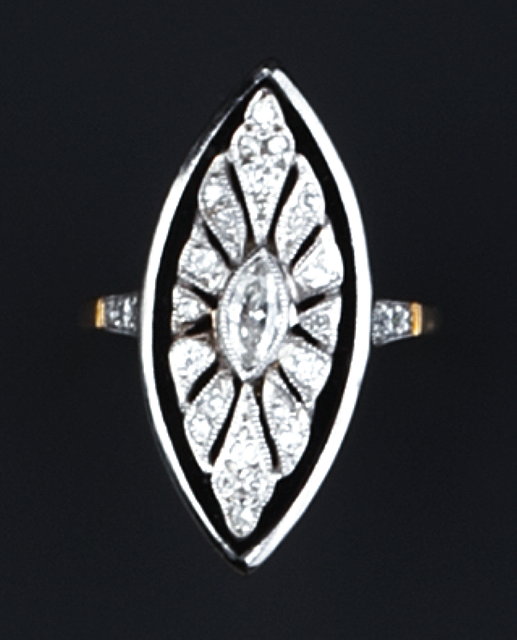 Appraisal: A DIAMOND AND ONYX PANEL RING the navette-shaped onyx panel