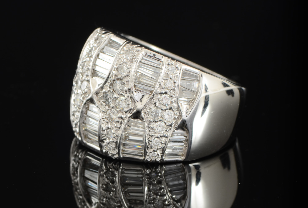 Appraisal: DIAMOND WIDE BAND DOME RING k white gold with baguette