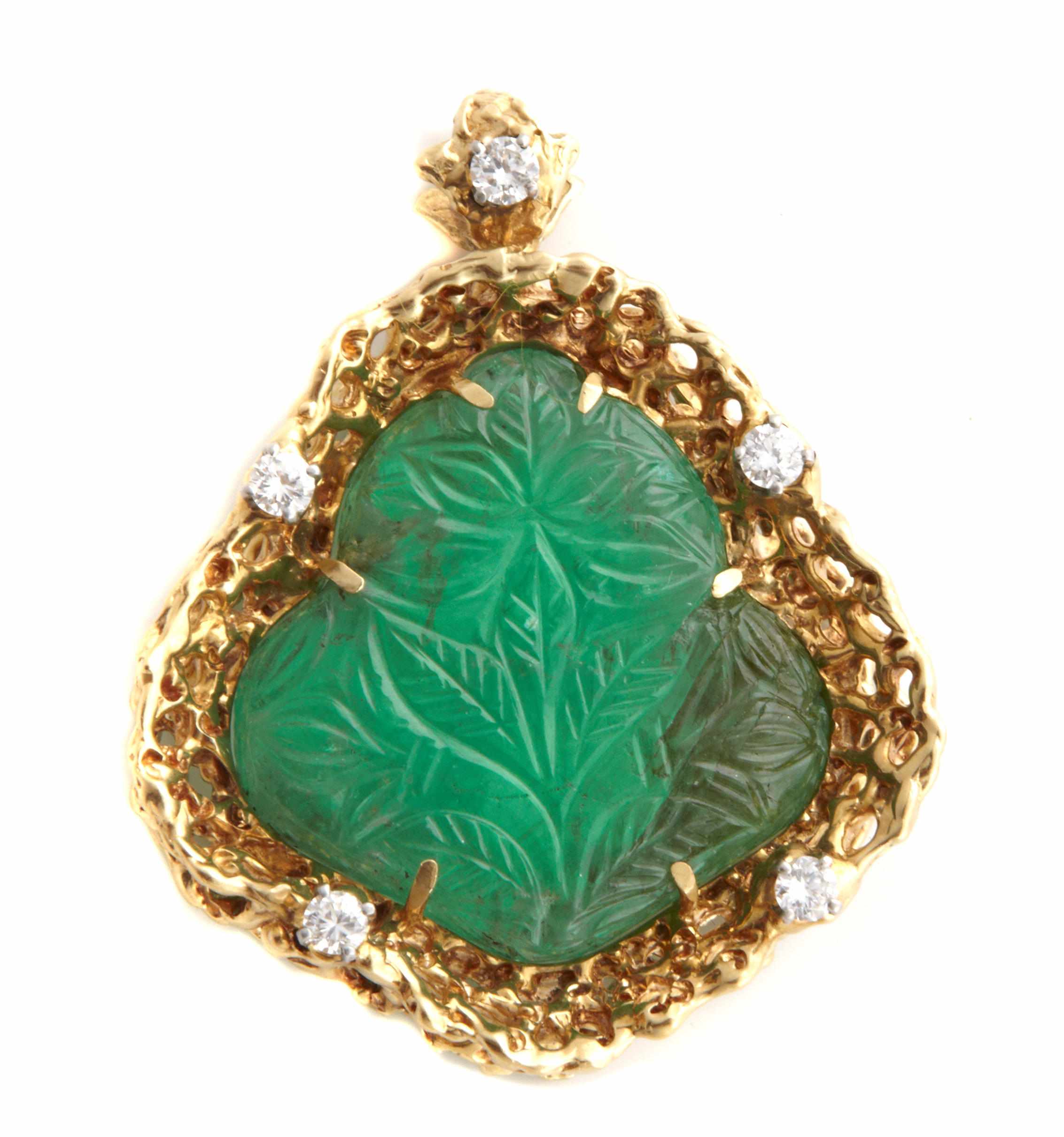 Appraisal: A carved floral motif emerald diamond and gold pendant with