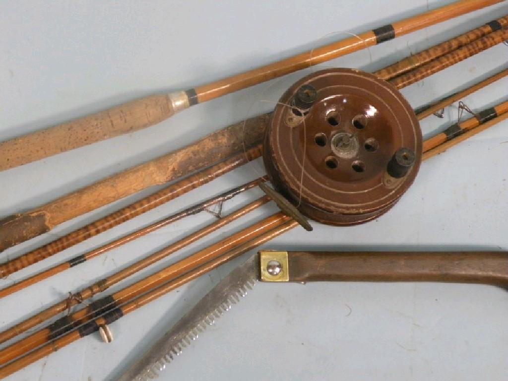 Appraisal: Two split cane fishing rods unmarked a wooden Scarborough type