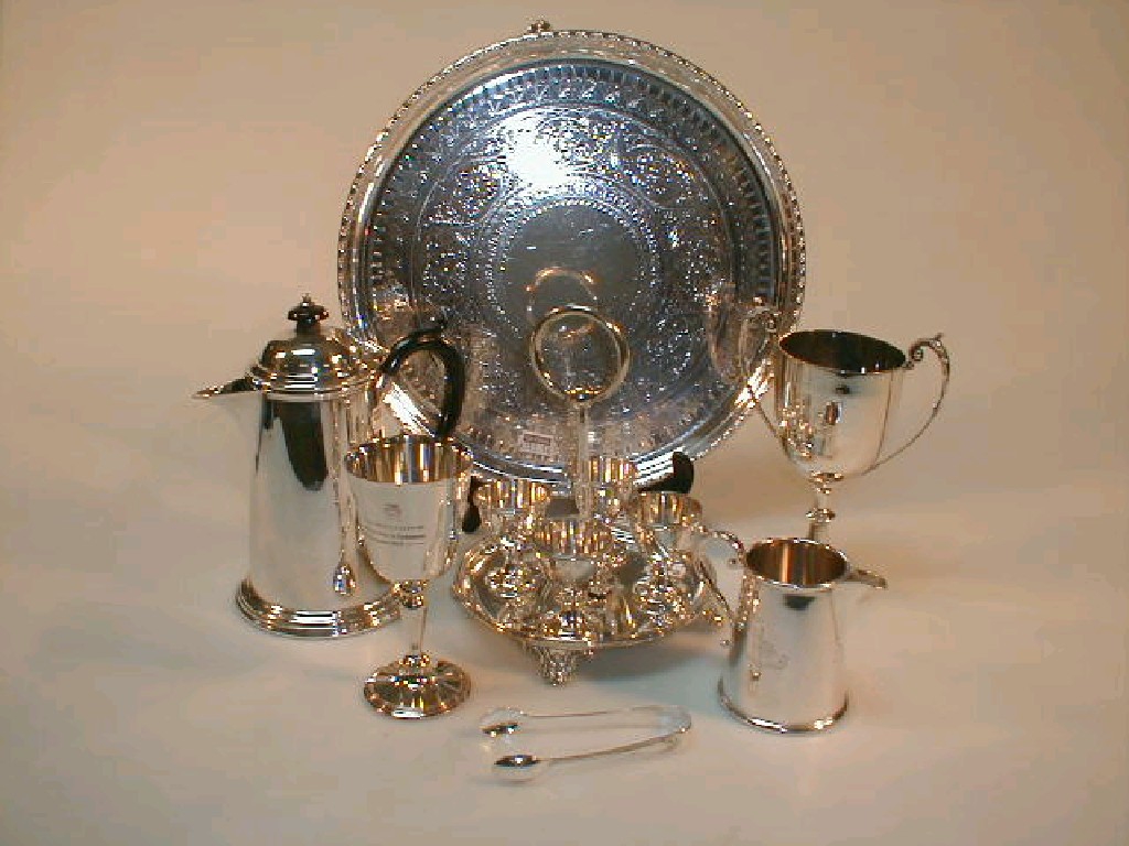 Appraisal: A silver plated egg cruet a silver plated circular salver