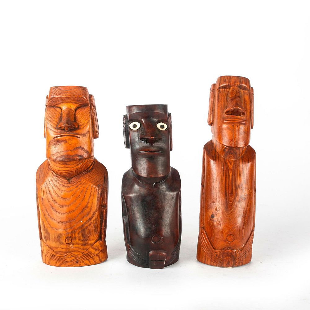 Appraisal: THREE WOODEN CARVED EASTER ISLAND MOAI SCULPTURES Wooden statues replicating