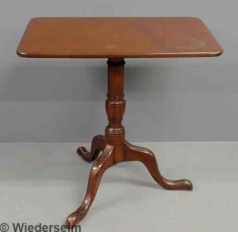 Appraisal: Georgian mahogany candlestand c with a rectangular top and urn-form