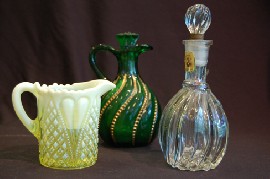 Appraisal: VICTORIAN OPALESCANT GLASS JUG GREEN GLASS JUG AND CRUET BOTTLE