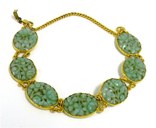 Appraisal: JEWELRY Jade bracelet tested K yellow gold seven oval carved