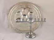 Appraisal: Judaica A chrome plated chanukia cm across and a plated