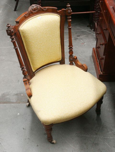 Appraisal: A Victorian walnut and yellow nursing chair