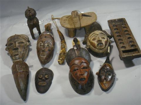 Appraisal: GROUP OF CARVED AFRICAN MASKS AND OBJECTS