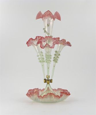 Appraisal: A pink and vaseline glass pergne with four trumpets rising