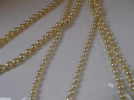 Appraisal: THREE STRANDS OF CULTURED PEARLS TO A SILVER CLASP