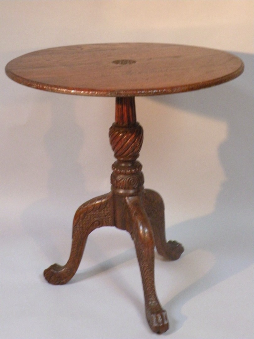 Appraisal: An early thC oak tripod table the circular top with