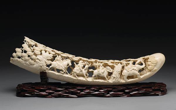 Appraisal: An ivory tusk carved with Daoist Immortals th Century Pierced