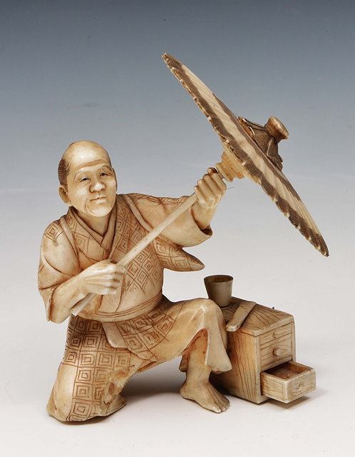 Appraisal: A Japanese ivory okimono of a umbrella restorerMeiji periodsigned Gyoku