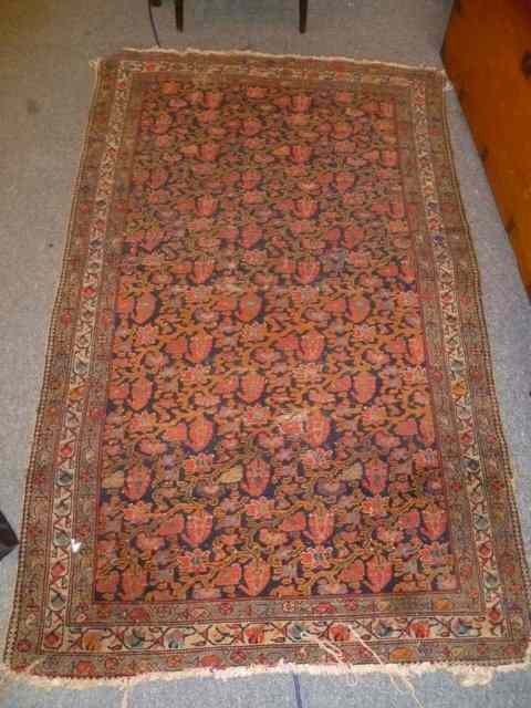 Appraisal: A CAUCASIAN BLUE GROUND RUG with allover foot and trailing