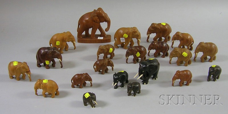 Appraisal: Twenty-one Small Carved Wooden Elephants some missing tusks ht to