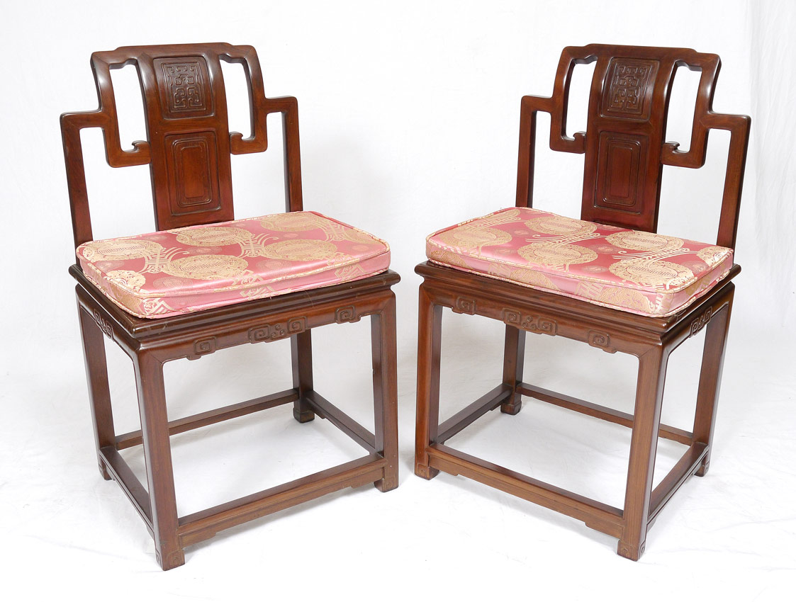 Appraisal: ORIENTAL CARVED CHAIRS Carved and shaped back skirt and feet