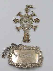 Appraisal: A silver wine label inscribed for brandy together with a