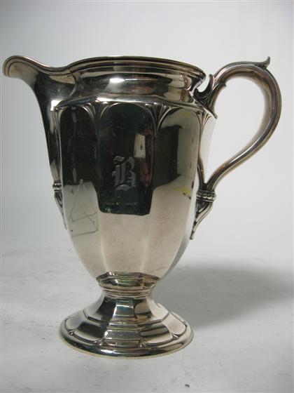 Appraisal: Sterling silver water pitcher th century Ten paneled urn design