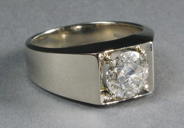 Appraisal: MAN'S DIAMOND AND FOURTEEN KARAT GOLD RING The white gold