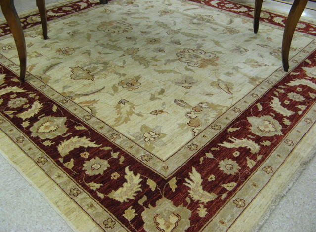 Appraisal: SQUARE HAND KNOTTED ORIENTAL CARPET Pakistani Zeigler overall floral decoration