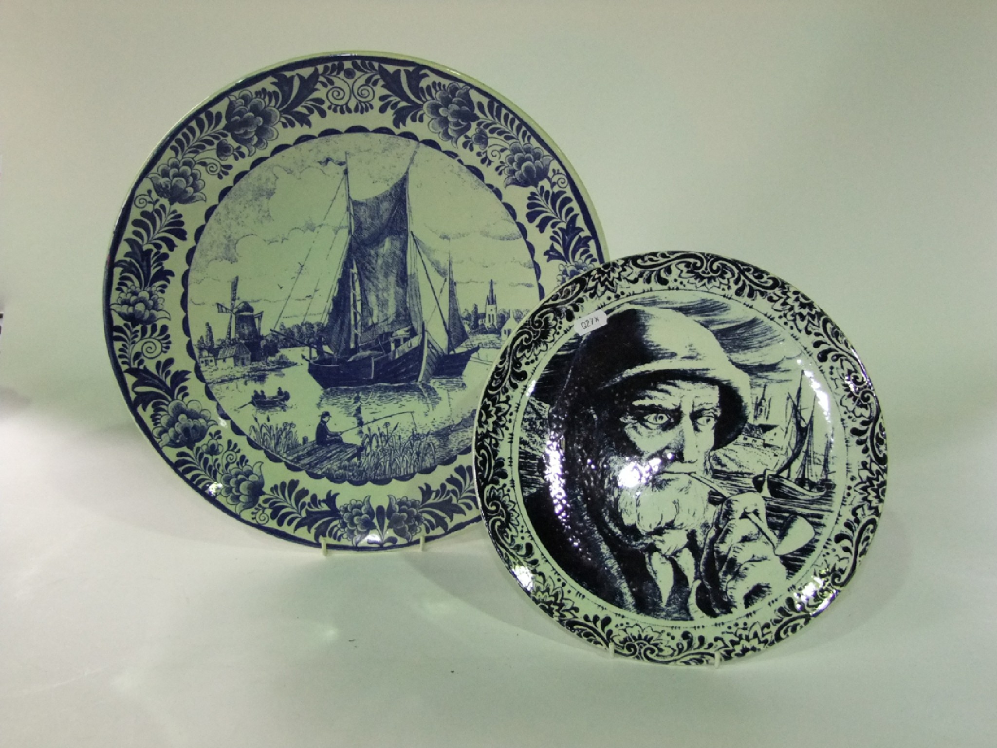 Appraisal: A pair of th century delft type chargers including a