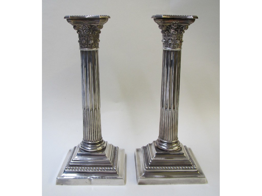 Appraisal: A pair of Sterling silver Corinthian column candl