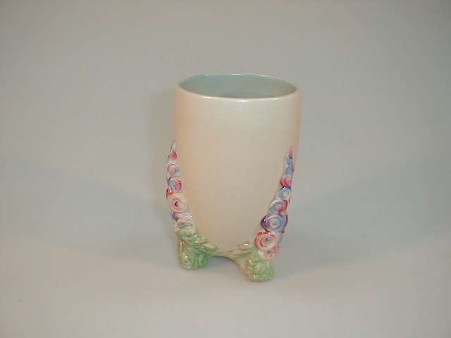 Appraisal: A Clarice Cliff Wilkinson pottery vase with three floral feet