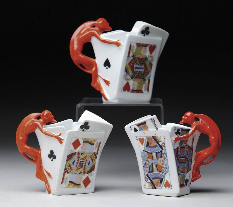 Appraisal: THREE ROYAL BAYREUTH DEVIL CARD CREAMERS Slightly different one being