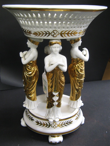 Appraisal: CERAMIC FIGURAL CENTERPIECE of four women in gold draped costumes