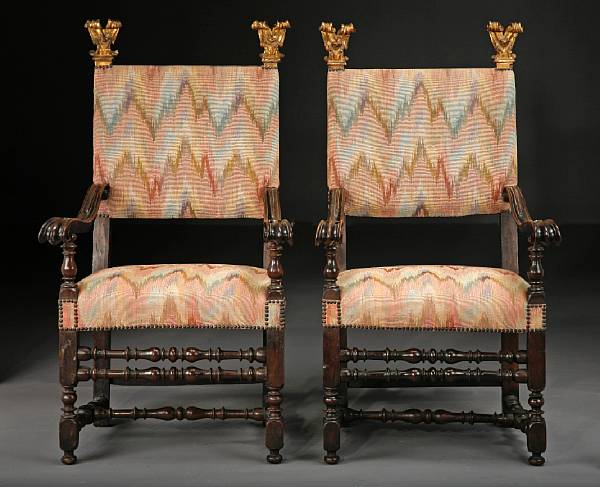 Appraisal: A pair of Italian Baroque style parcel gilt walnut armchairs